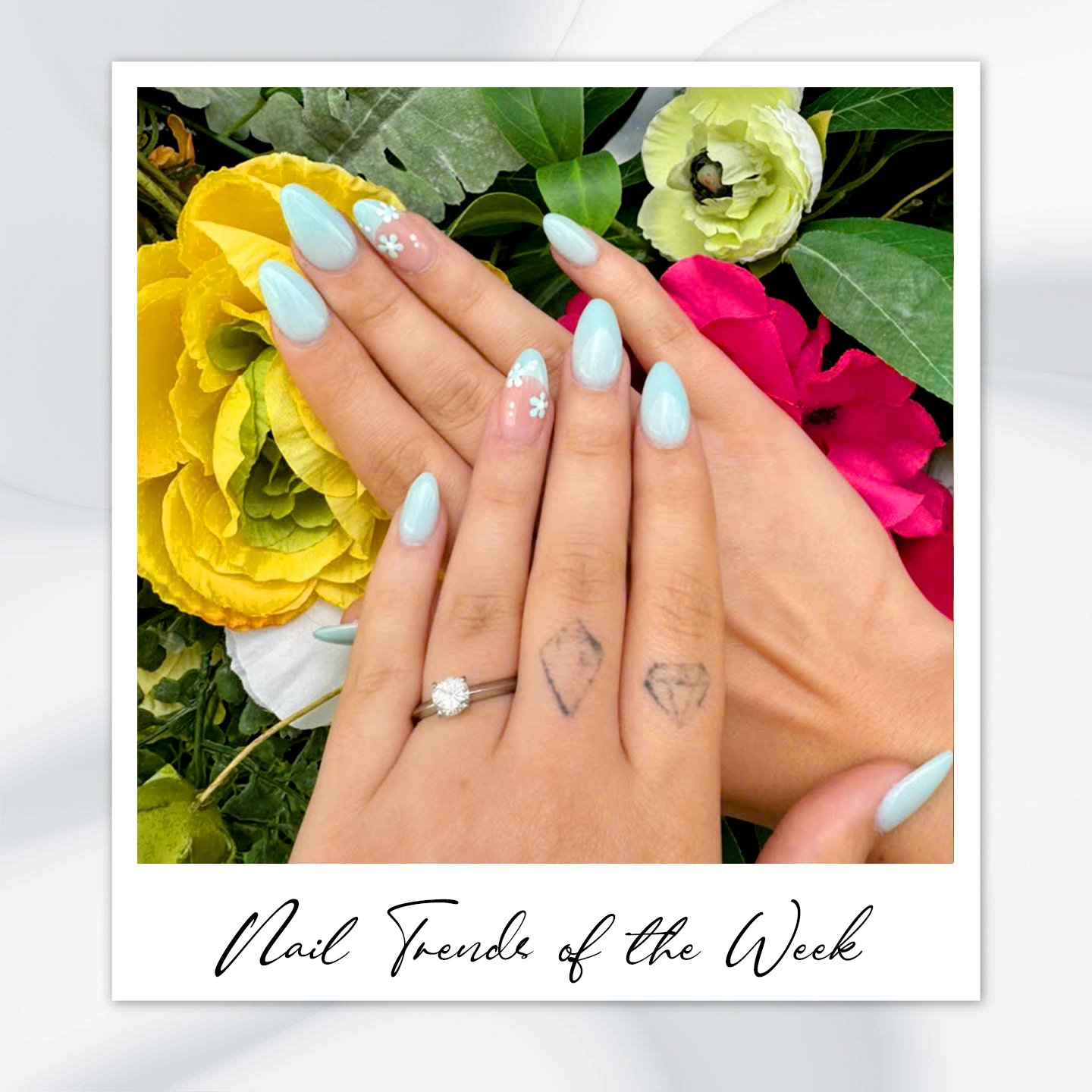 9 Almond Nail Designs You’ll Want to Try This Summer 3 Light blue almond nails with floral French tip – featuring almond nail art, almond-shaped nails, floral almond nail designs, and classy almond nail colors perfect for summer 2025.