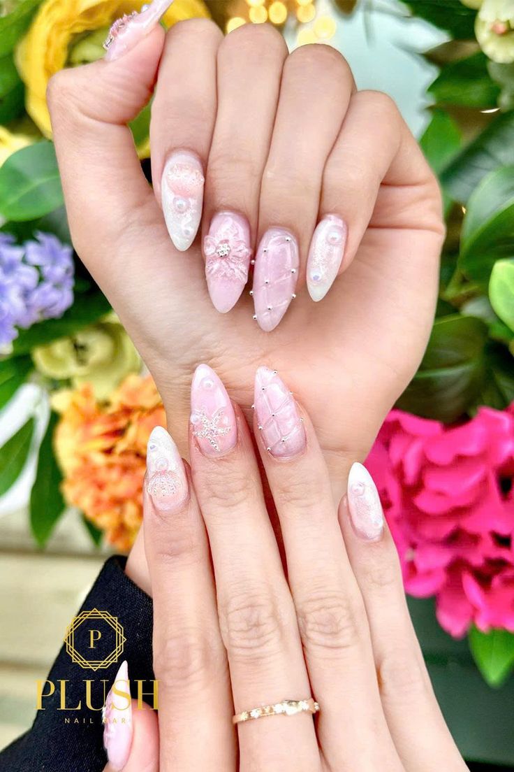 3D pink nails with pearls, bows, rhinestones, and glitter textures, pink glitter nails, glittery pink nails, pink acrylic nails with glitter, bridal pink nails, baby pink nails, nail art for pink nails, pink nails design.