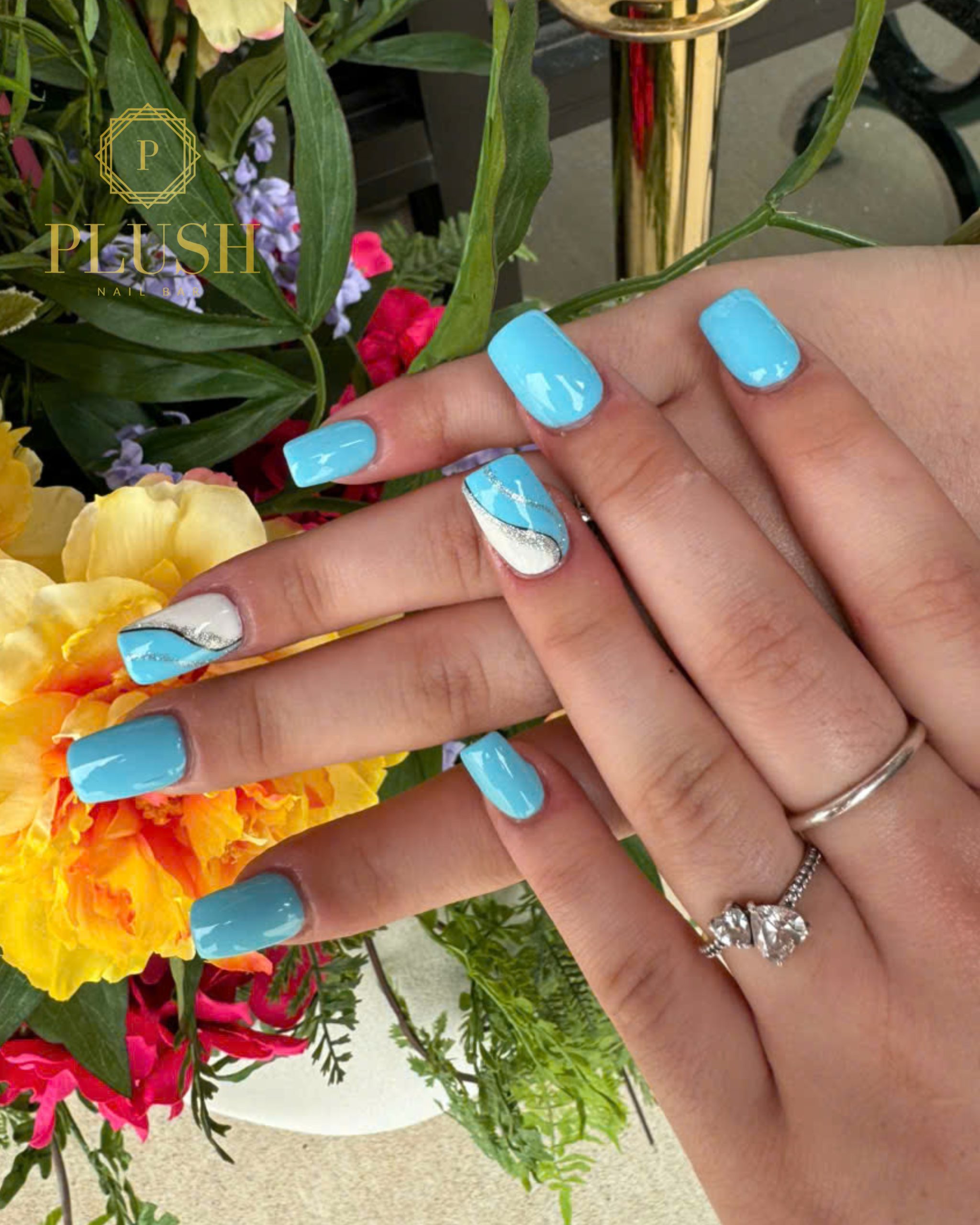 Top 5 Summer Nail Designs You Need to Try in 2025 3 Short square nails in ocean blue with silver accent design – trendy short gel nails at Plush Nail Bar, perfect for summer 2025 with vegan gel manicure option.