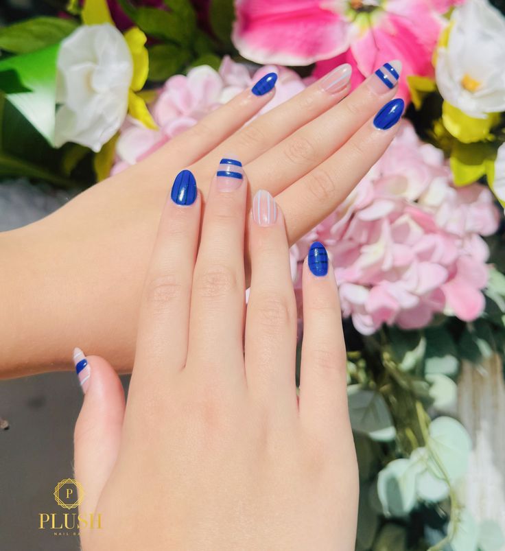 Classy 4th of July nail design with deep navy blue polish, horizontal and vertical stripe accents, and subtle white line detailing. This minimalist and modern patriotic manicure is perfect for those who prefer clean, sophisticated 4th of July nails without over-the-top decorations. A stylish option for July nail designs, subtle 4th of July nails, or simple patriotic nail art for summer events.
