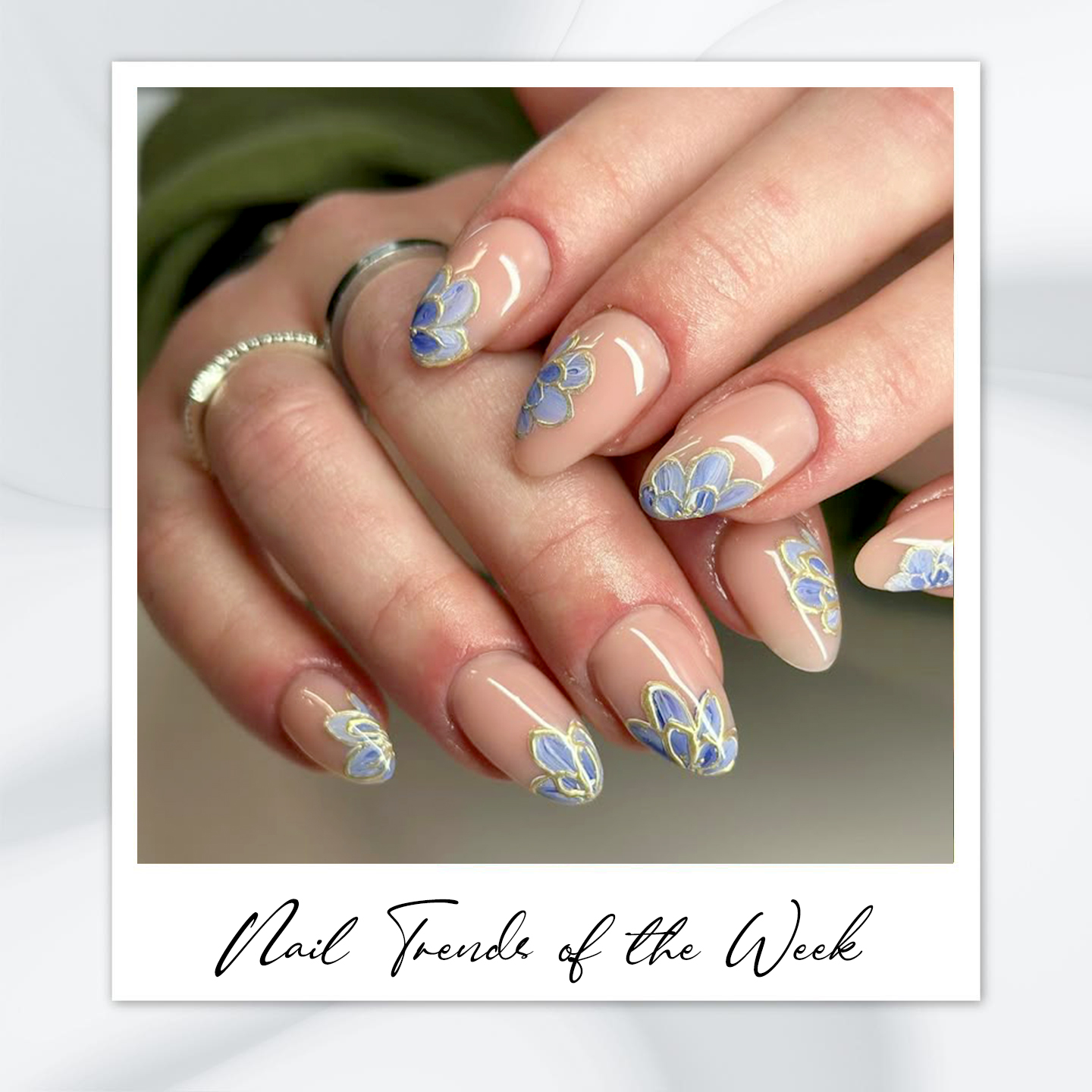 9 Almond Nail Designs You’ll Want to Try This Summer 8 Almond nail designs with blue floral nail art and gold outlines – featuring almond nail art, blue almond nails, classy almond nail design, and soft summer almond nails.