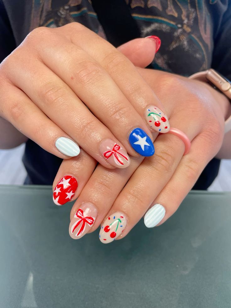 Cute 4th of July nails featuring red cherry nail art, blue star accents, red bow designs, and pastel striped tips. This fun and playful 4th of July nail design blends classic red, white, and blue tones in a fresh way. Perfect for anyone looking for simple 4th of July nails, cute fourth of July nails, or July 4th nail art ideas. A great example of patriotic nail art that’s both trendy and unique, ideal for summer celebrations, fireworks parties, or festive nail inspiration. Includes elements from fourth of July nails simple, subtle 4th of July nails, and July nail designs.