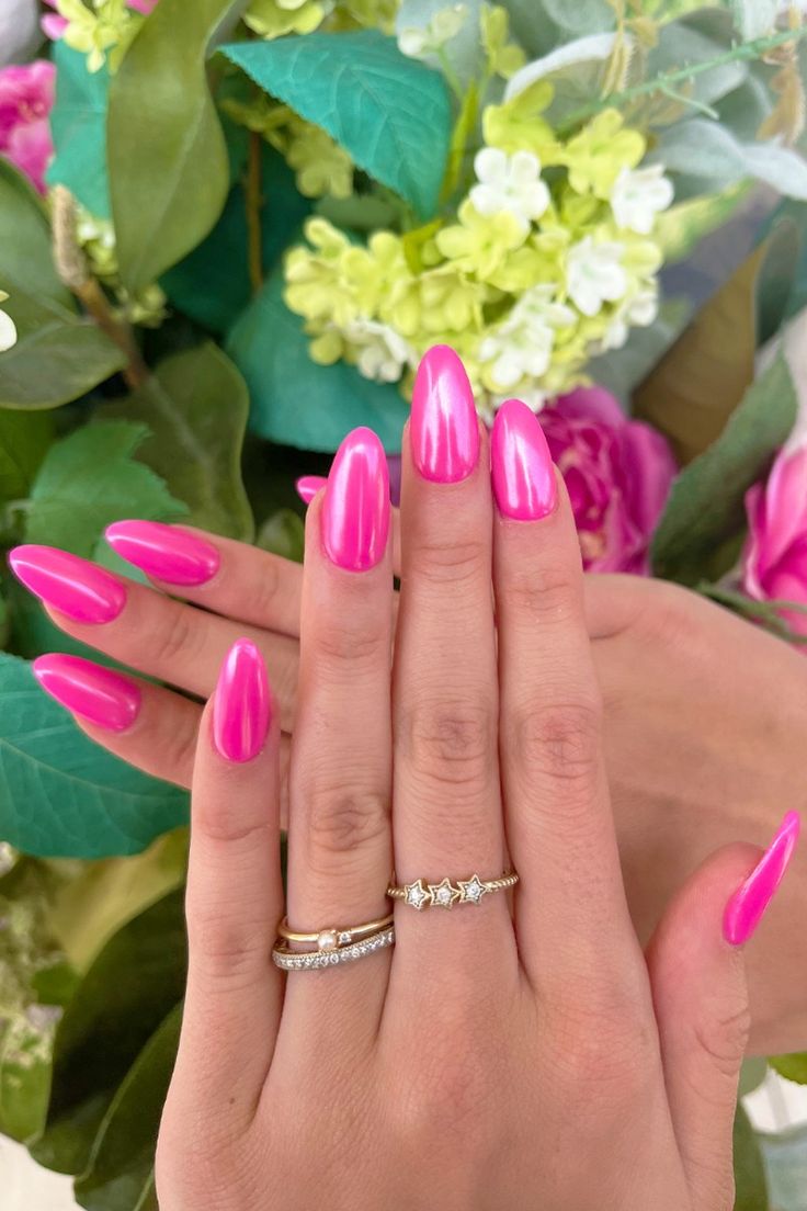 Hot pink chrome nails in almond shape featuring a jelly finish, perfect for summer 2025 trends. This high-shine pink nails design blends jelly pink nails, chrome pink nails, pink nails acrylic, and glittery pink nails with a bold and vibrant look.