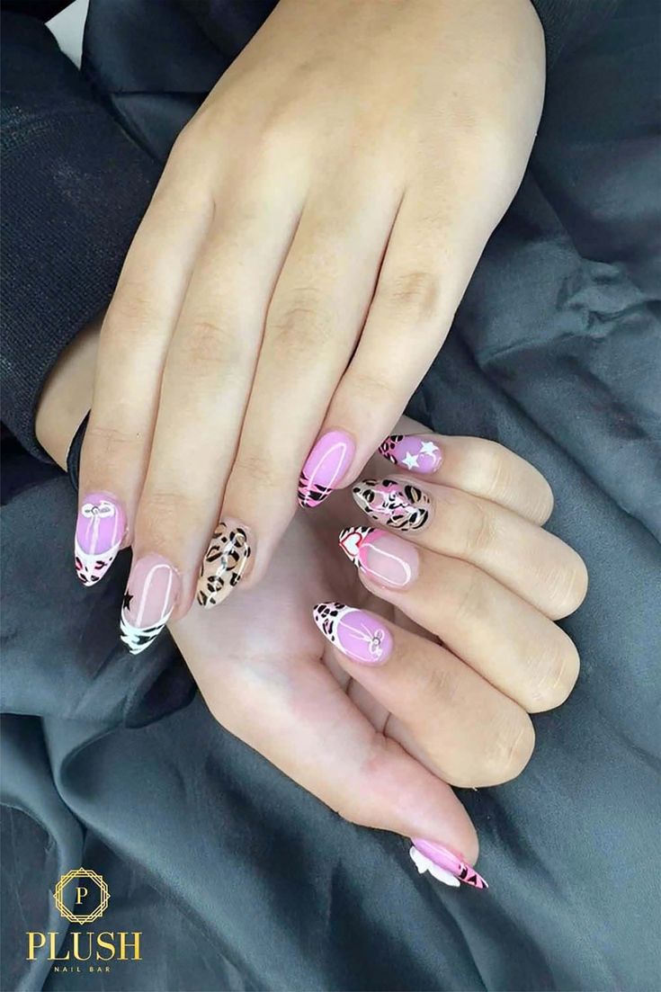Leopard print and pink nails with animal patterns, glitter accents, nail art for pink nails, pink and black nails, pink ombré nails, pink nails designs, glitter and pink nails, cute pink nails, light pink nails with design.